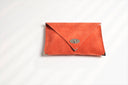 Symmetria soft clutch in coral: Gold / Large